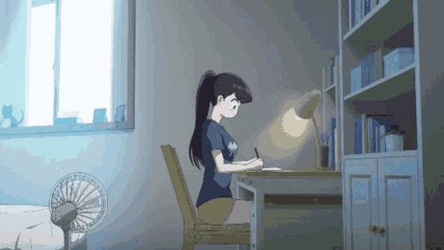 a girl is sitting at a desk with a lamp on