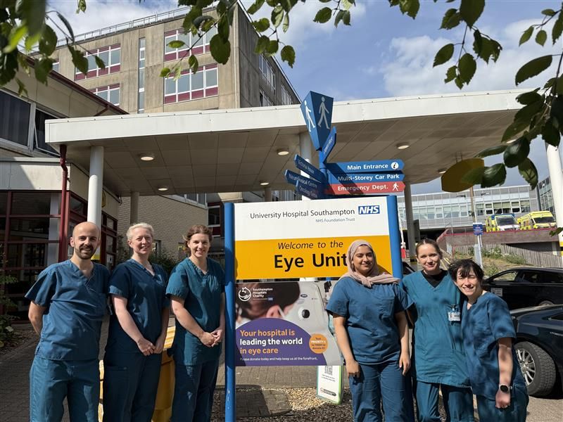 Photo (left to right) of UHS staff: Tomos, Megan, Helen, Safa, Jessica and Hedydd stood outside the Eye Unit. 