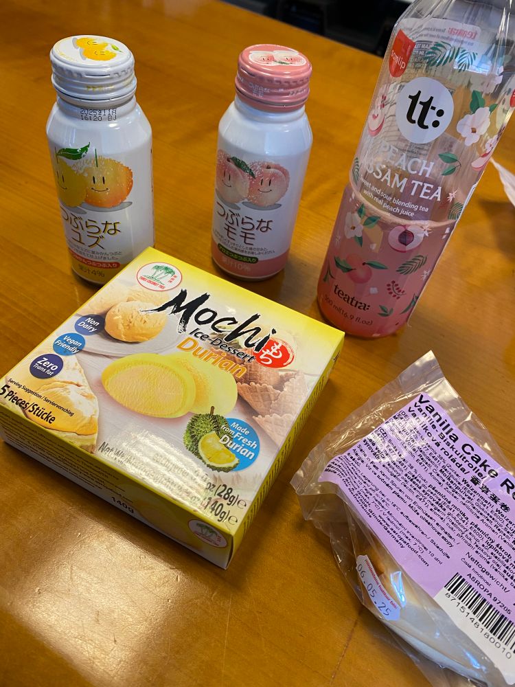 We’ve got an Asian store around the corner and love treating ourselves to some new drinks and snacks each time.

Today we have peach, orange and lemon flavored drinks (not all of them are in the picture). We also had cake and Mochi ice cream with the "Regret" flavor. I mean durian.