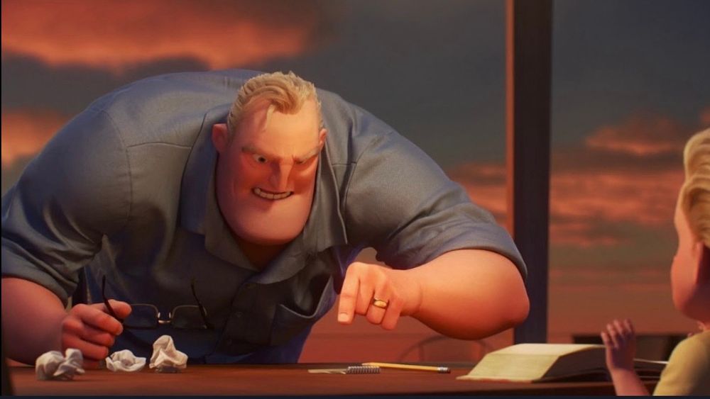 Mr. Incredible pointing at something on table. 