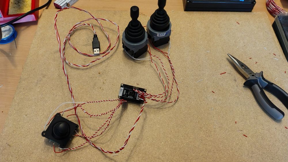 Custom controller prototype. Attached to a SJ@JX-220 board are two GUUZI 2 way Momentary switch Joysticks, one Legefirm (generic) 4-way joystick. Wired up with dupont connectors on the joysticks and one jst connector for the custom usb cable. 