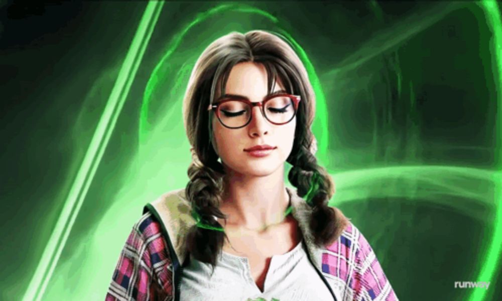 a woman wearing glasses stands in front of a green background that says runway on the bottom