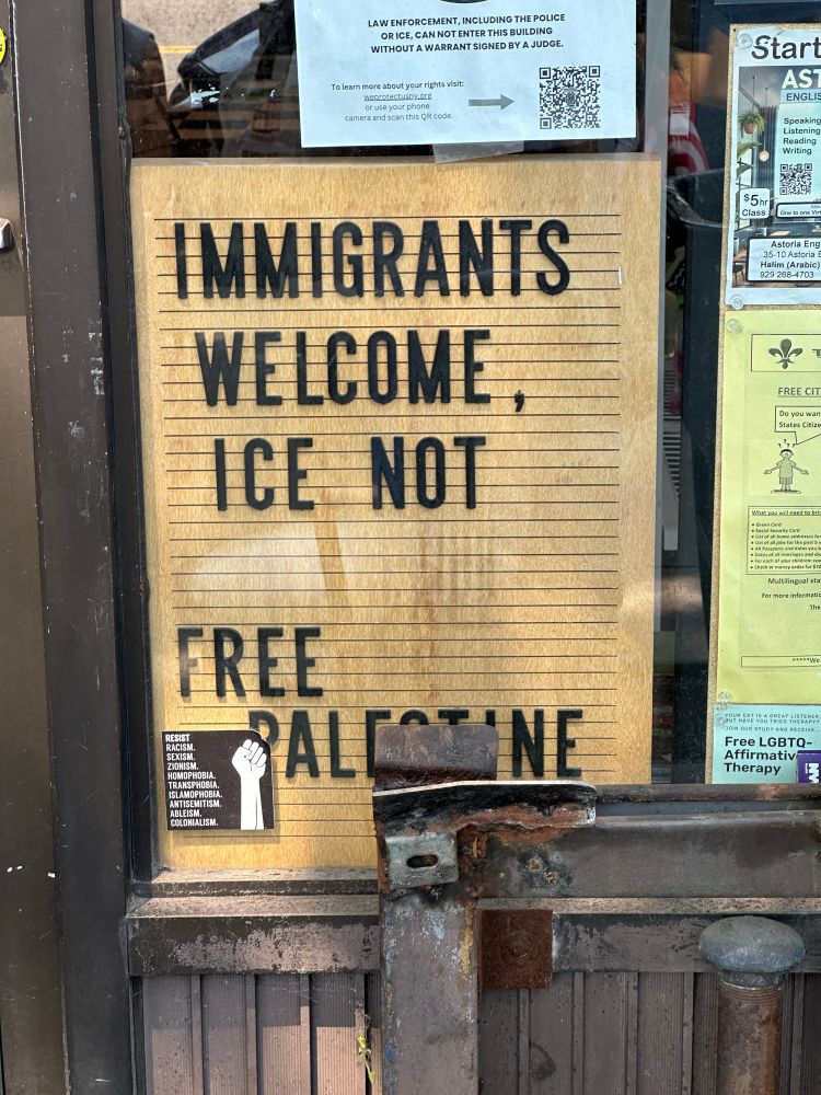 Sign that says “Immigrants welcome, ICE NOT/ Free Palestine” on the front of the Astoria Food Pantry in Queens. 