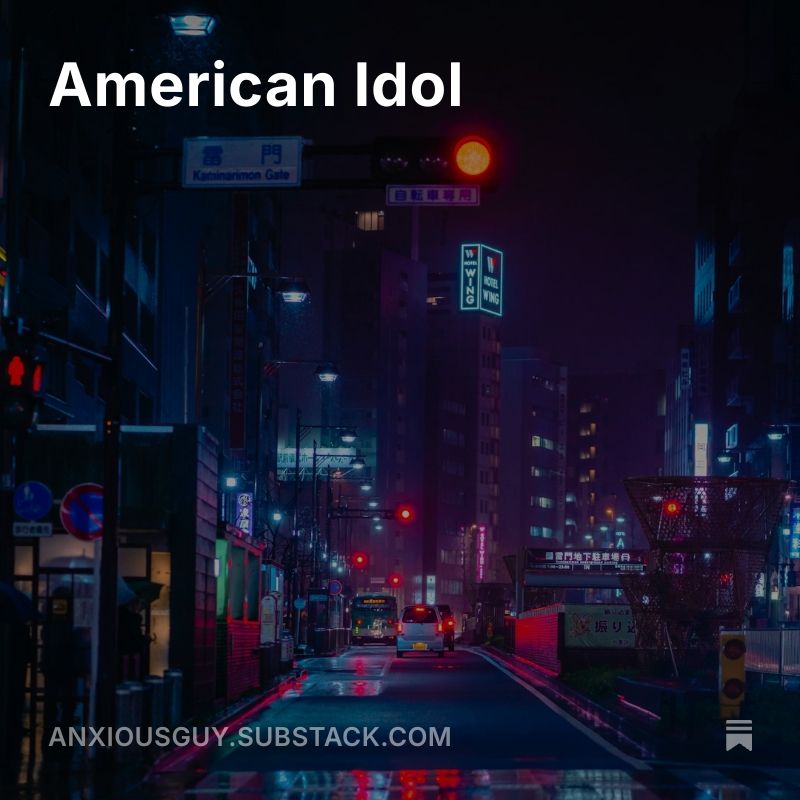 A street bathed in neon light advertising my substack.