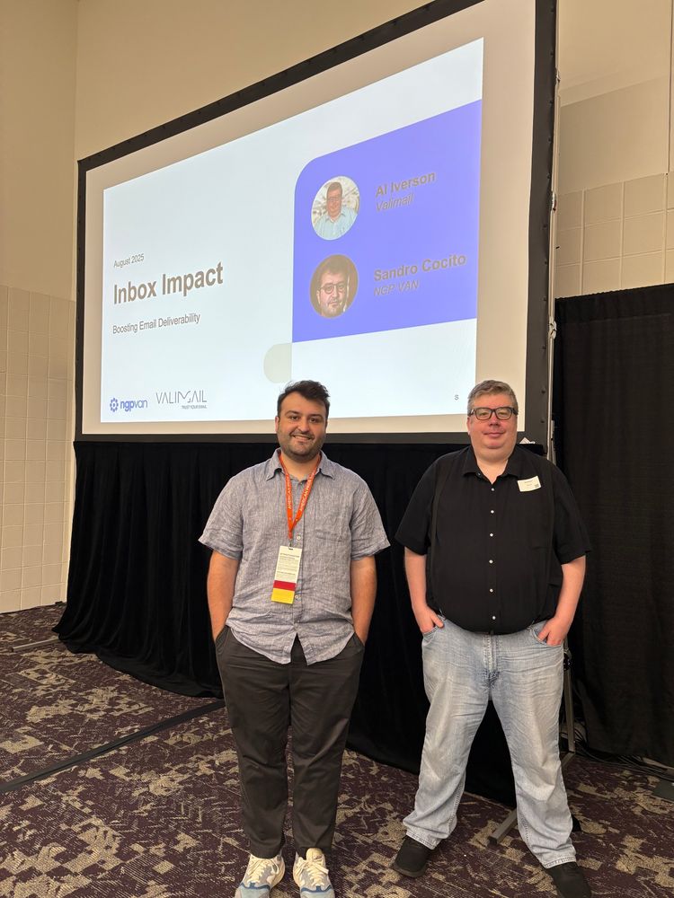Sandro Cocito from NGP VAN and Al Iverson from Valimail in front of a projector screen
