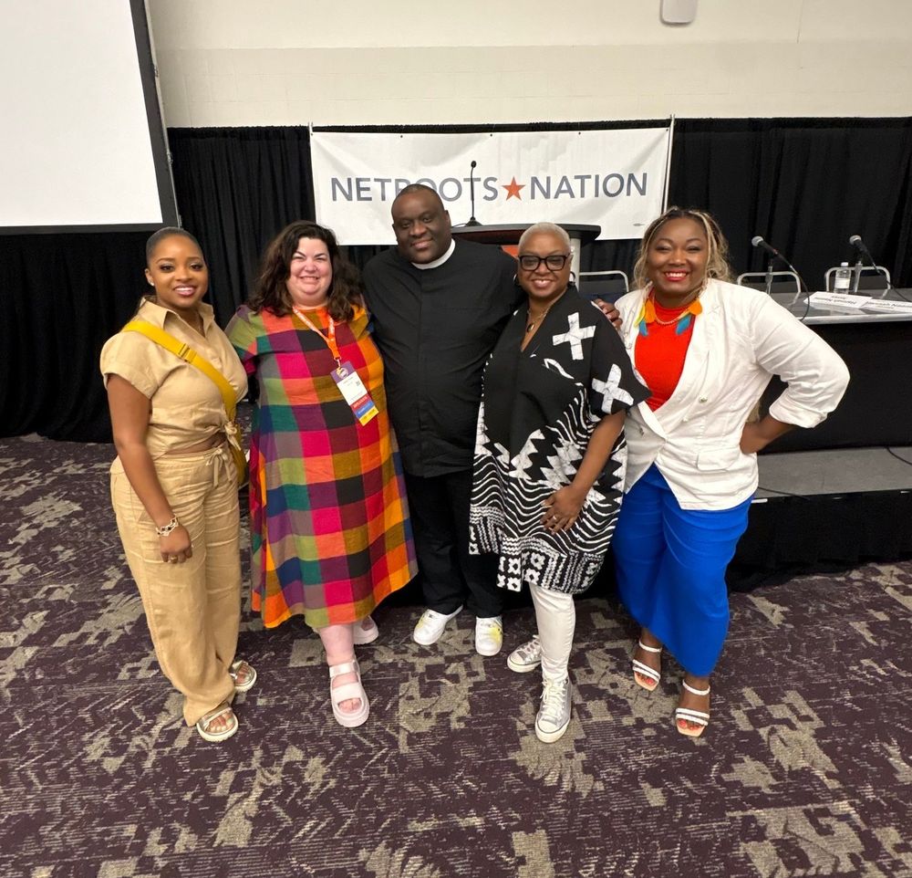 A photo of the moderator and panelists from Black Church PAC in front of a Netroots Nation banner