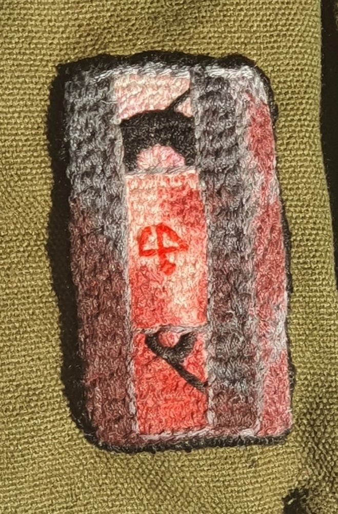 A embroidered patch of a Generation Loss cassette with a red marker on it to give it an illusion of fake blood 