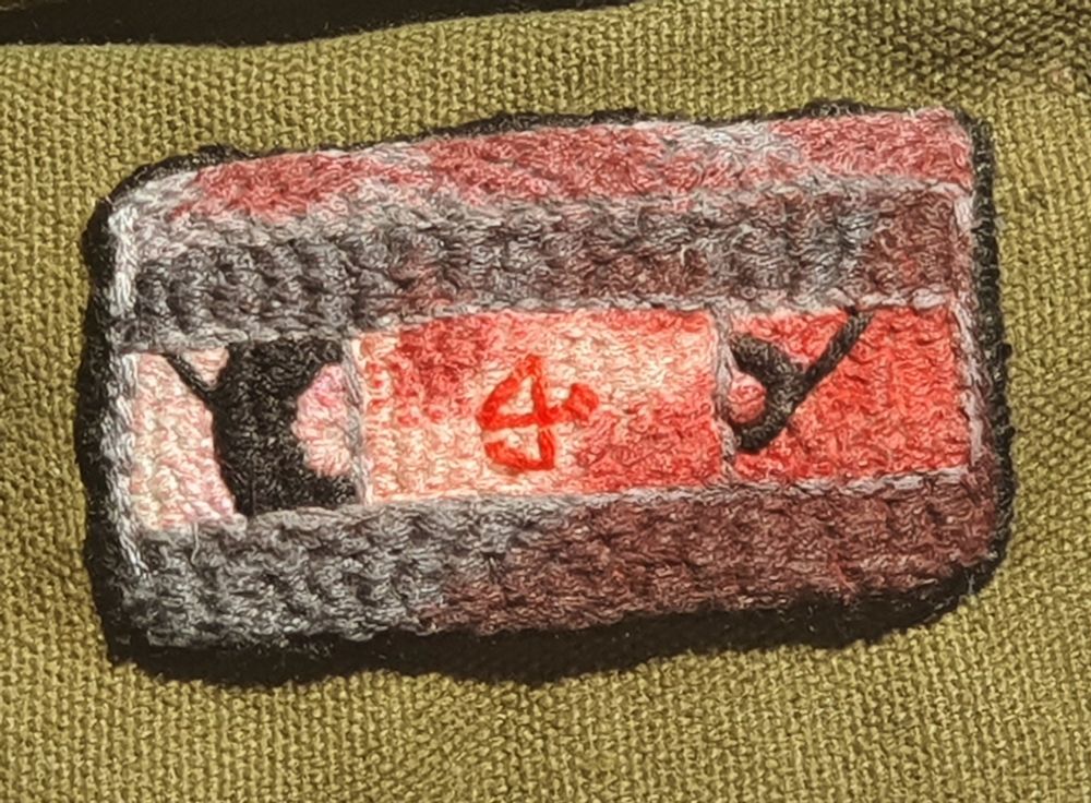 A embroidered patch of a Generation Loss cassette with a red marker on it to give it an illusion of fake blood 