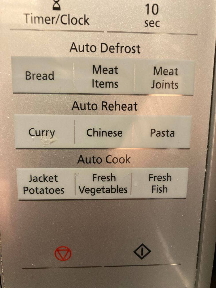 Control panel of a microwave listing bread, meat items, meat joints, curry, Chinese, pasta, jacket potatoes, fresh vegetables, fresh fish 