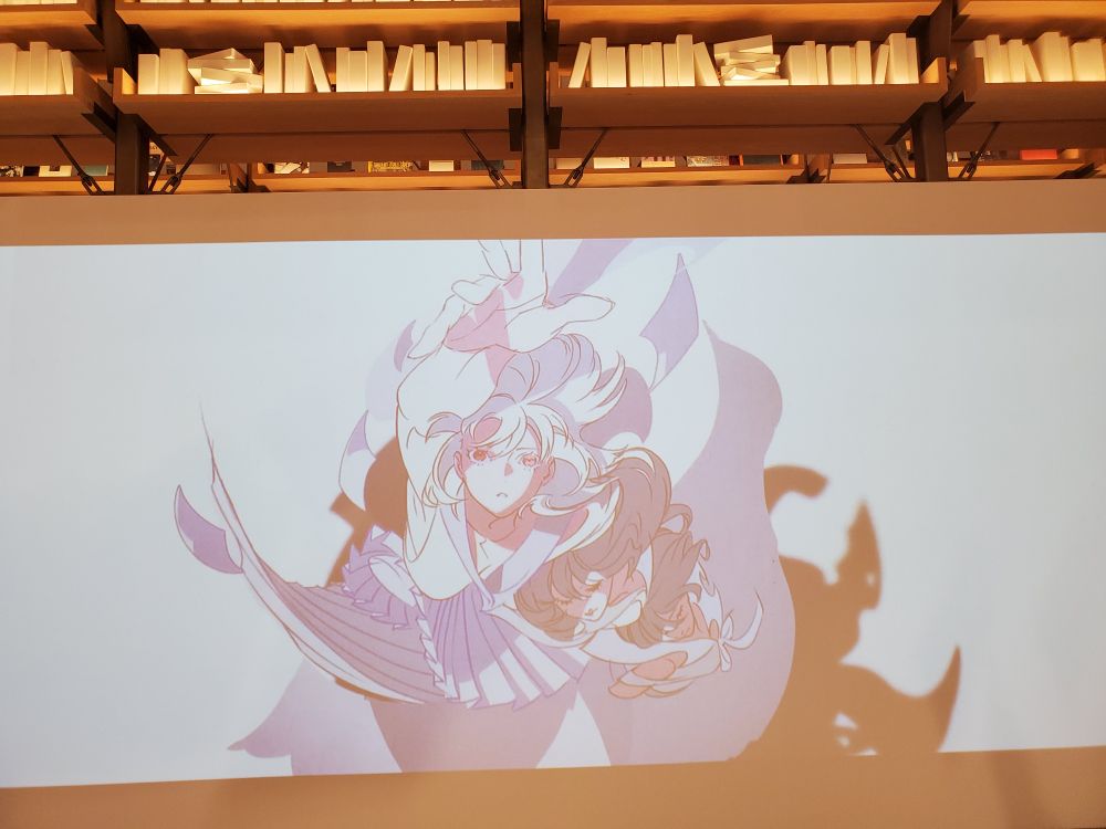 スクリーンに映された連続アートによるアニメーションの写真