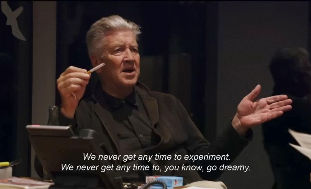 A still of David Lynch on the production of Twin Peaks: The Return. He gesticulates angrily while brandishing a cigarette. Caption reads: “we never get any time to experiment. We never get any time to, you know, go dreamy.”