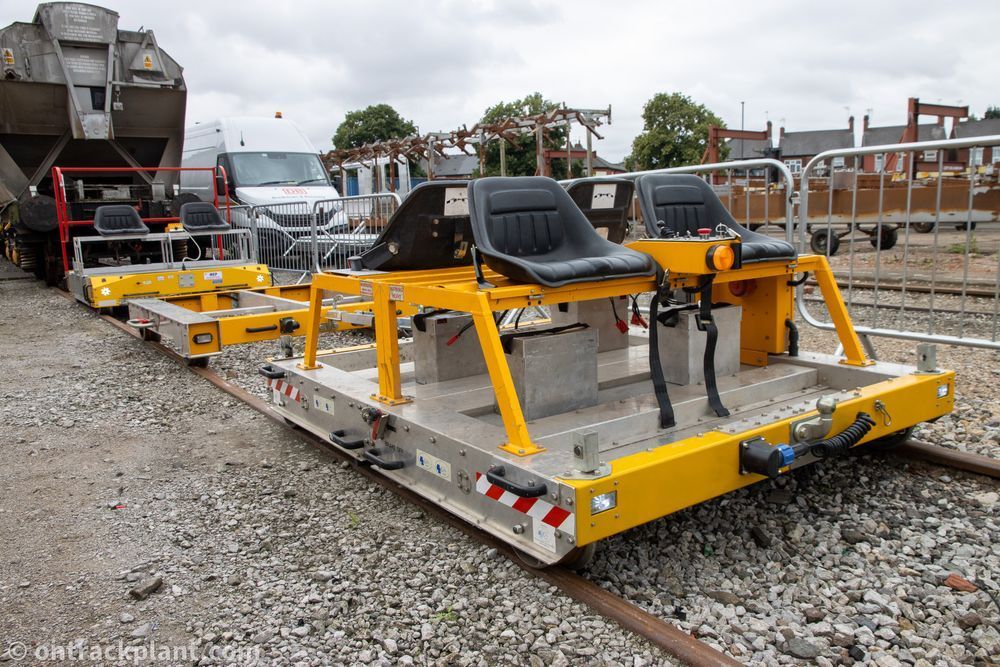 a small motorised rail-mounted trolley with four seats.