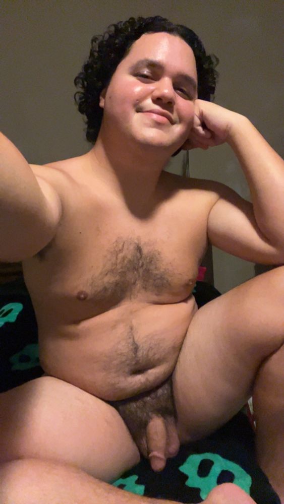 Selfie of a naked man (me), sitting up on the edge of his bed