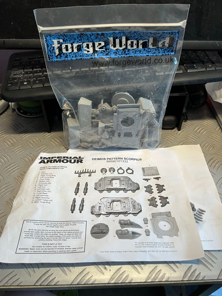 Instructions and bag of bits from Forge World for building a Deimos Pattern Scorpius. 