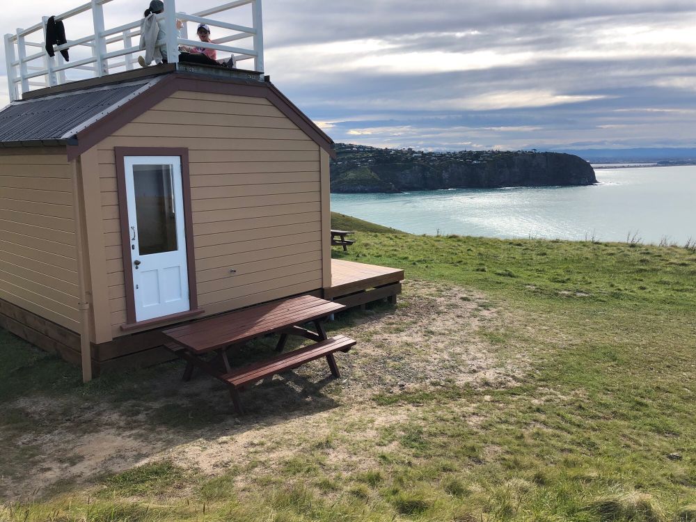 Cabin with view of ocean and headland