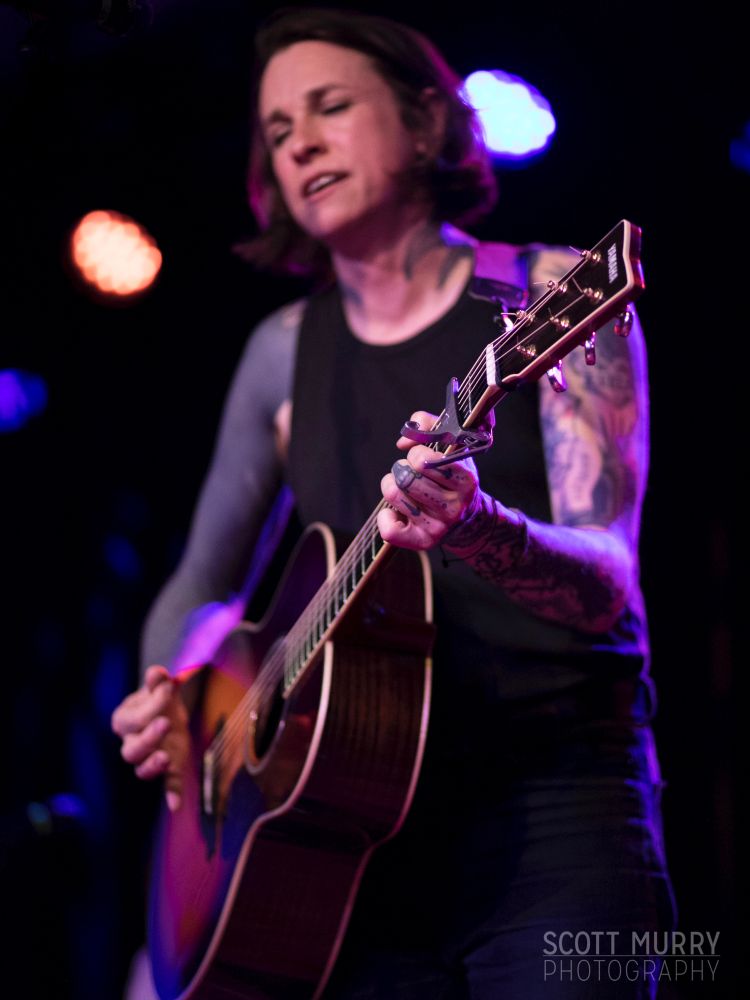 Laura Jane Grace playing an acoustic guitar solo in Cambridge, MA.