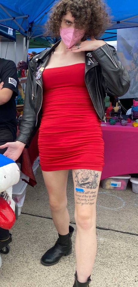 At cape and cowl con with my red titty dress and black leather jacket