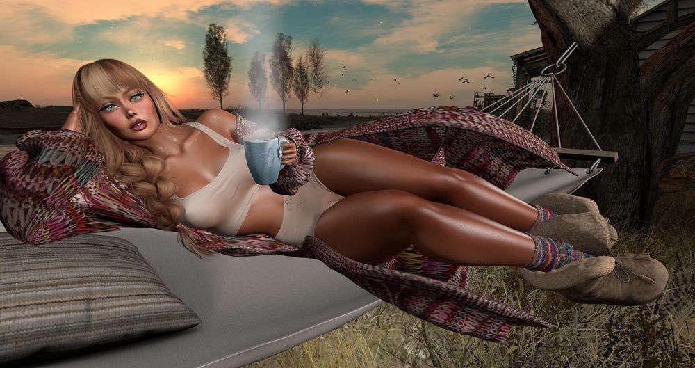 Female #Secondlife avatar resting on a hammock during sunset, drinking a cup of hot tea, wearing loungewear top and shorts, a long knit cardigan sweater and booties with socks.