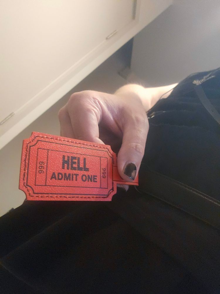 Tag that reads 'Hell, Admit One, 666'