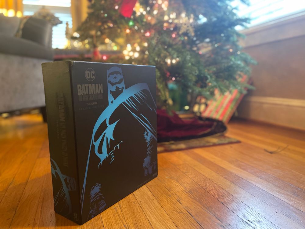 Box for Dark Knight Returns: The Game standing in front of Christmas tree