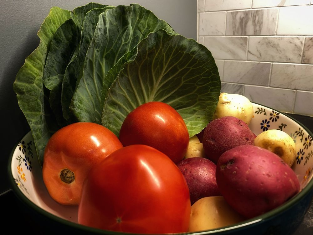 Veggies on the counter. Red tomatoes and potatoes.