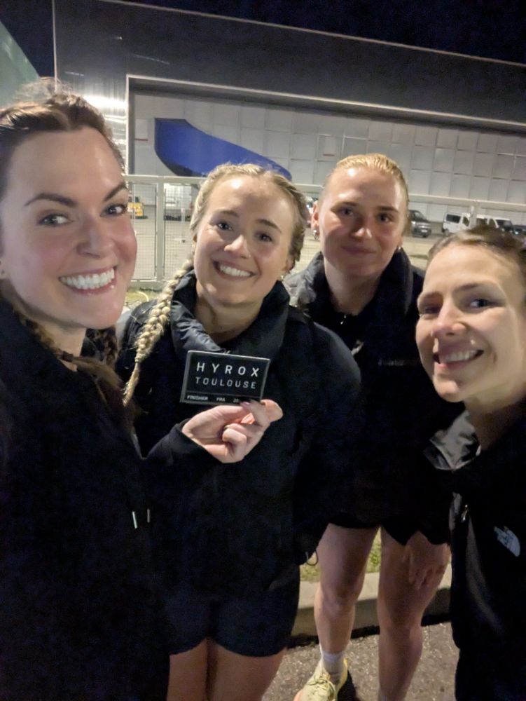 Emma and three other girls smiling 