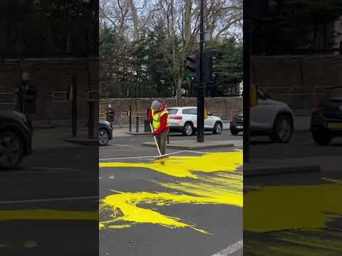 Protesters paint huge Ukraine flag outside Russian embassy in London