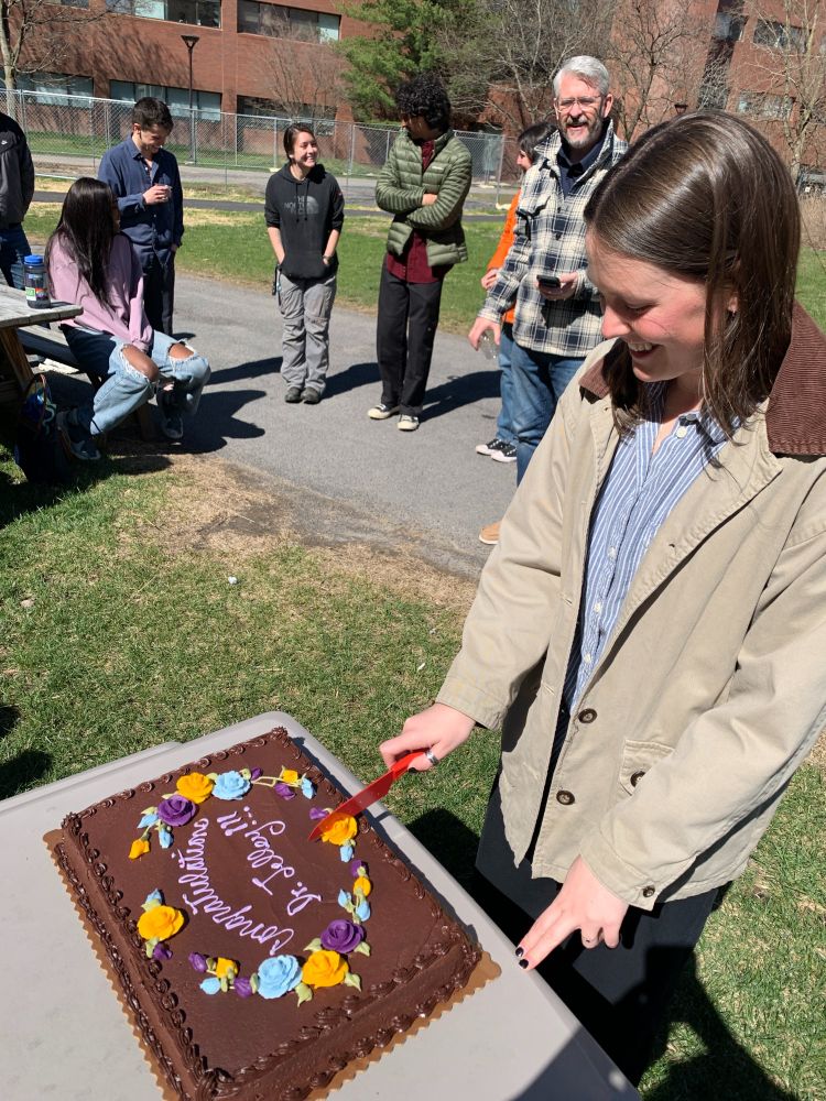 Dr. Jelley cutting her cake