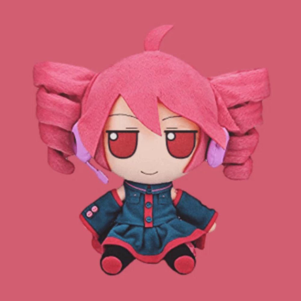 a stuffed doll with pink hair is sitting on a pink surface