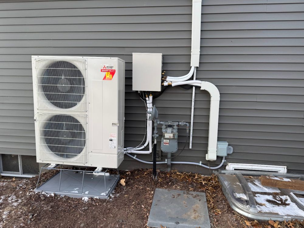 The gorgeous condenser for a Mitsubishi 3-ton heat pump installed outside our home
