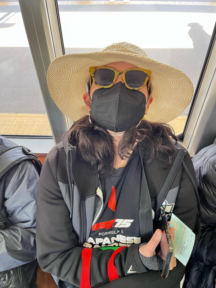 Mollie is incognito. She’s got on dark shades, a big hat, and a black k95 mask.