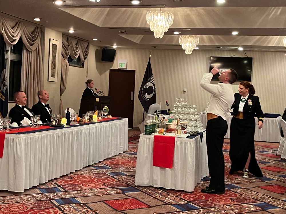 At a dining out, CDR Morris was brought forward to the President of the mess to answer for crimes against the Wardroom. For various violations, no fewer than 5 trips were made.