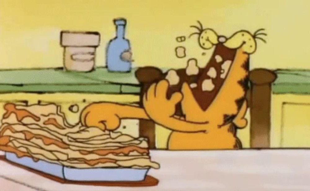 a cartoon of garfield eating a pie with his mouth open