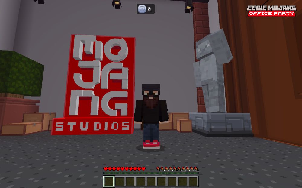 in game screen shot of a player standing in front of a Mojang Studios display