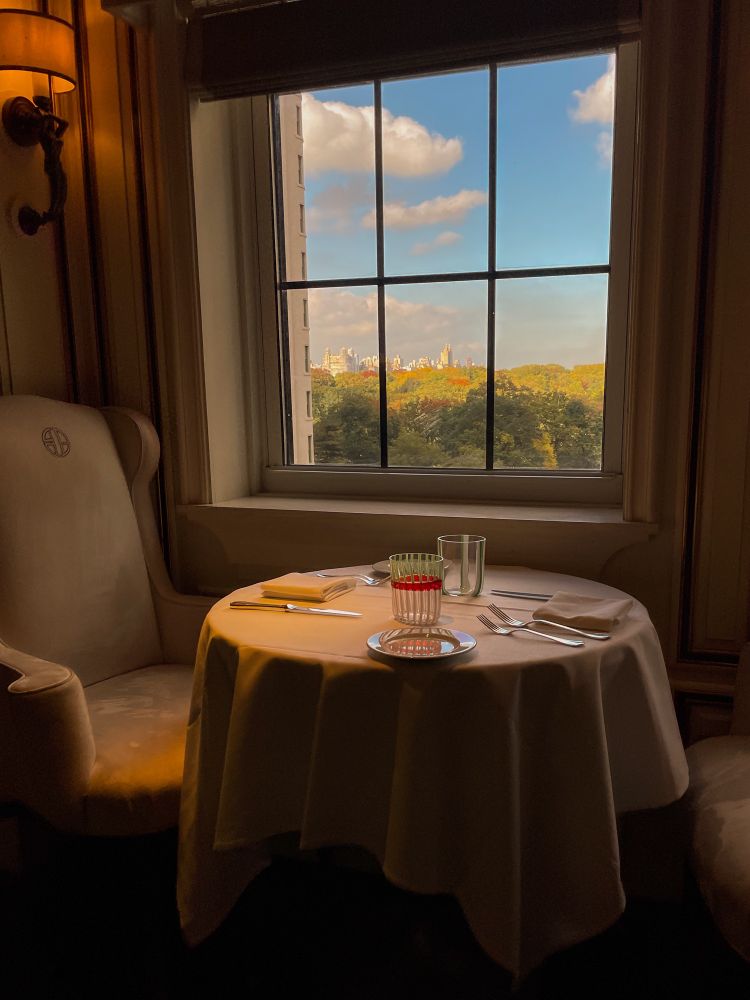 A picture of an empty table in Bergdorf Goodman’s restaurant overlooking Central Park