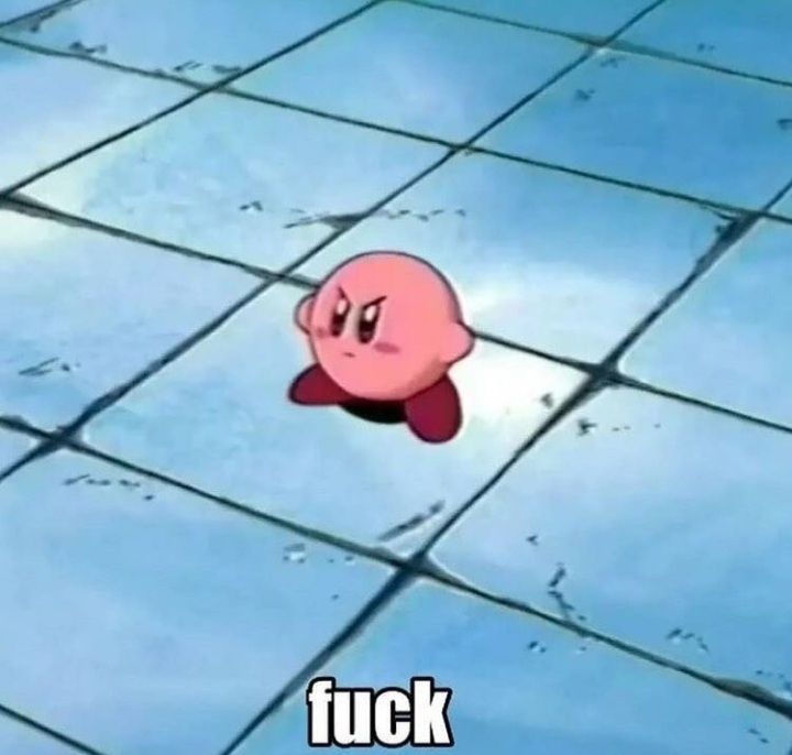 A picture of kirby standing in the middle of the room with the caption "Fuck"