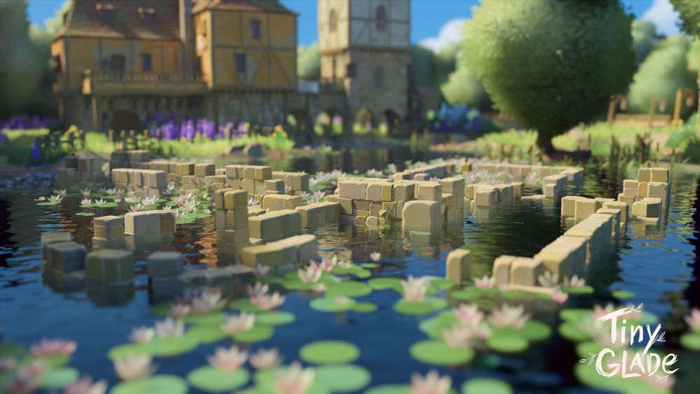 tiny glade screenshots of ruins in a lake. a medieval village is in the background