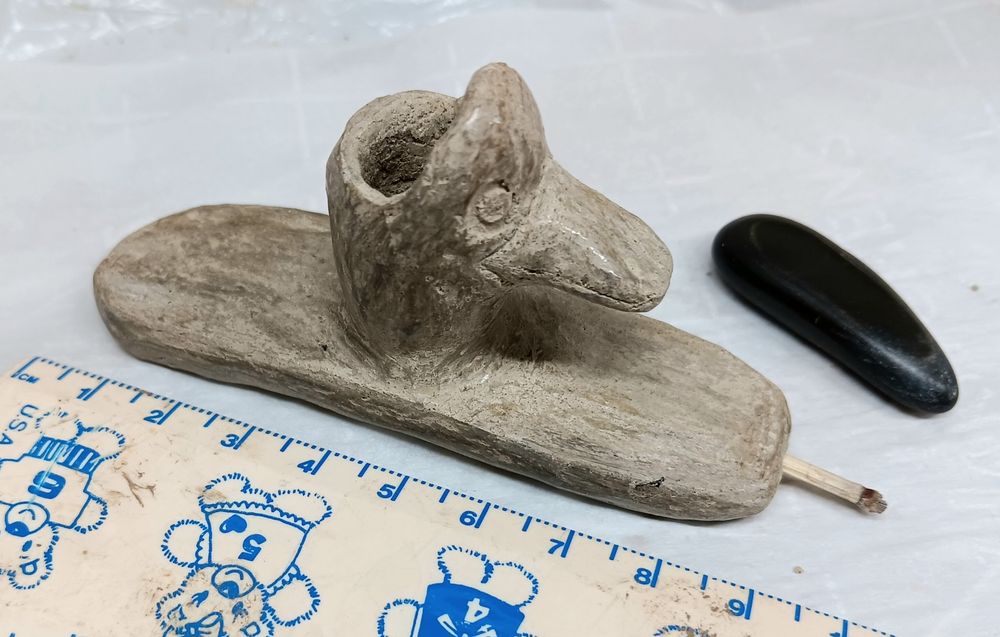 Duck head platform pipe of gray green clay 9 cm long, 2.5 cm wide & 4.5 cm tall.