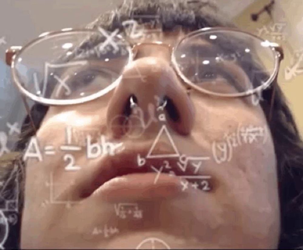 a close up of a person 's face with mathematical equations written on it