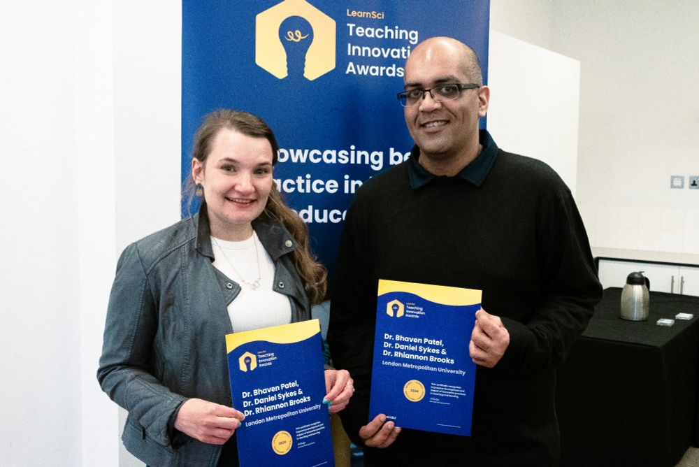 Dr Brookes and Dr Patel holding their certificates at the Teaching Innovation Awards. 
