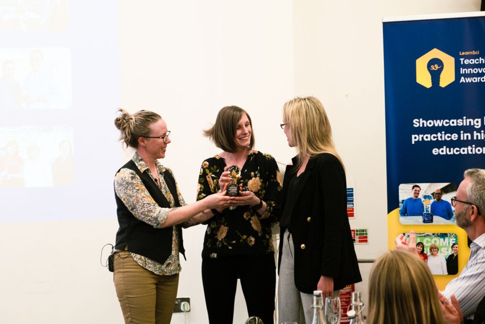 Dr Leanne Williams handing over Teaching Innovation Award to winners Dr Alexandra Moores and Dr Emma Hargreaves.