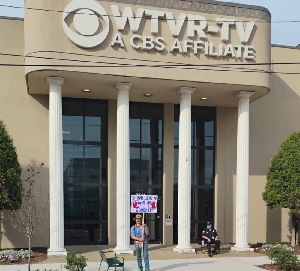 Protest sign outside CBS affiliate in Richmond Virginia reading "5 million April 5th cover it!"
