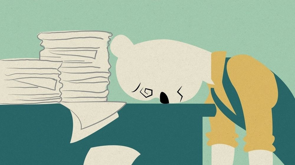 The white bear furry (Michael self-insert?) from FNaF Pizzeria Simulator, with tired spiralling eyes, head on his desk, and stacks of papers piled high on it.