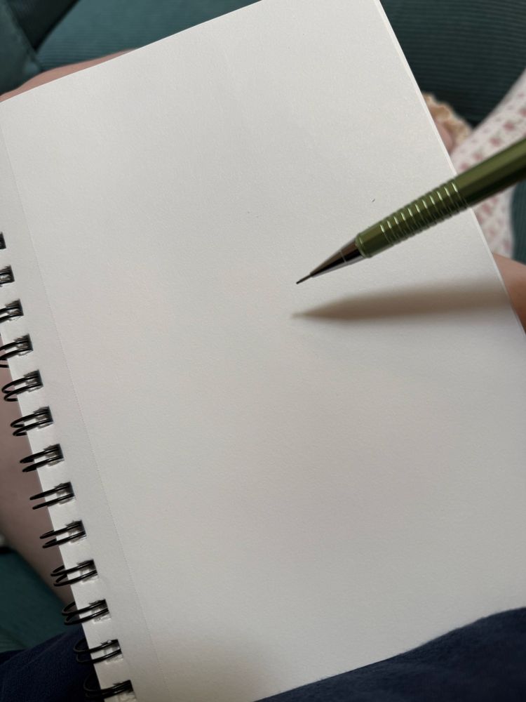 A blank sketchbook page with a mechanical pencil hovering over, ready to draw!