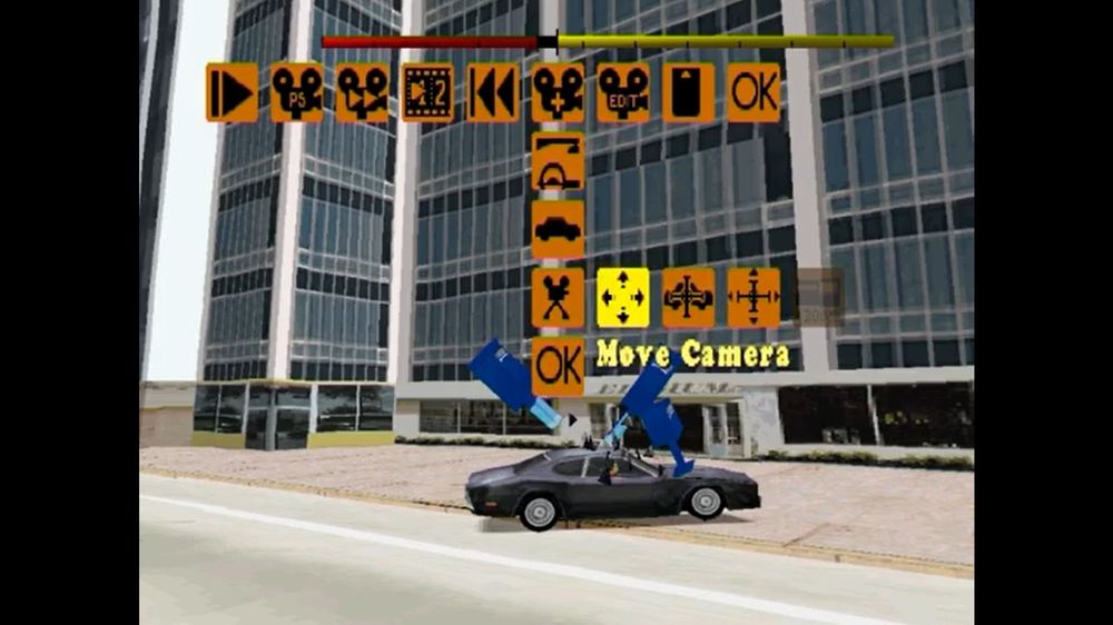 A replay editor in the game Driver showing a car busting through street telephones  while selecting a "move camera" button from the game's replay interface.