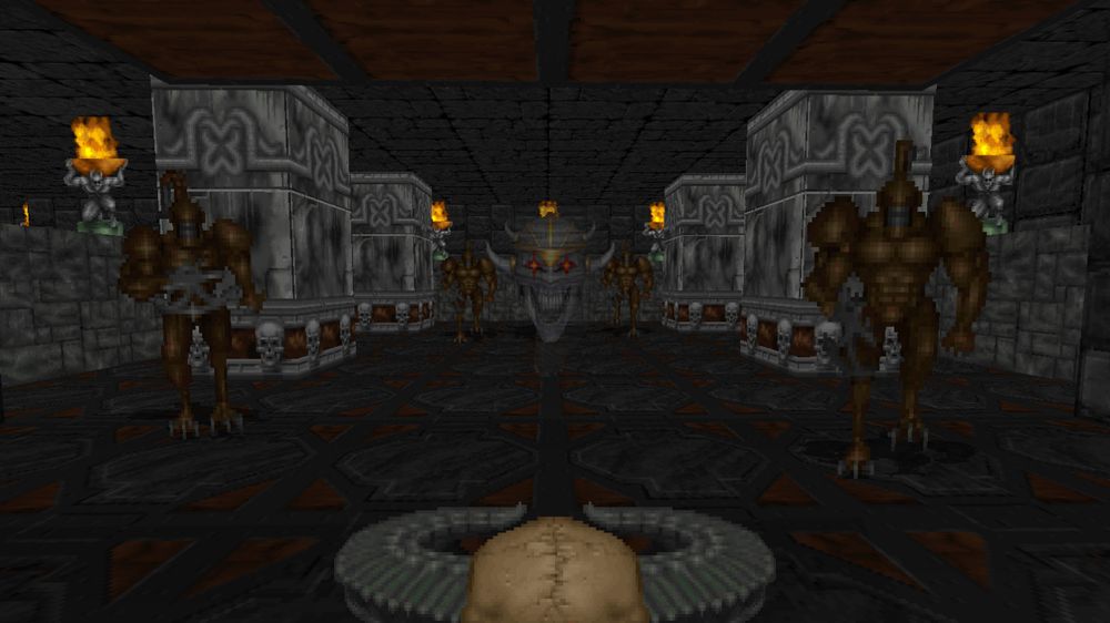 Screenshot of Heretic. Facing a big floating skeleton head with a wizard staff in a dungeon.
