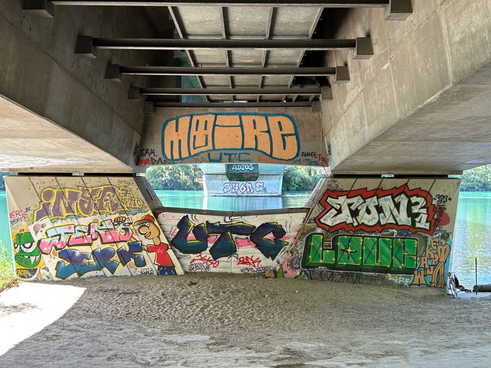 Under-bridge graffiti along the Rhône River in Lyon, France