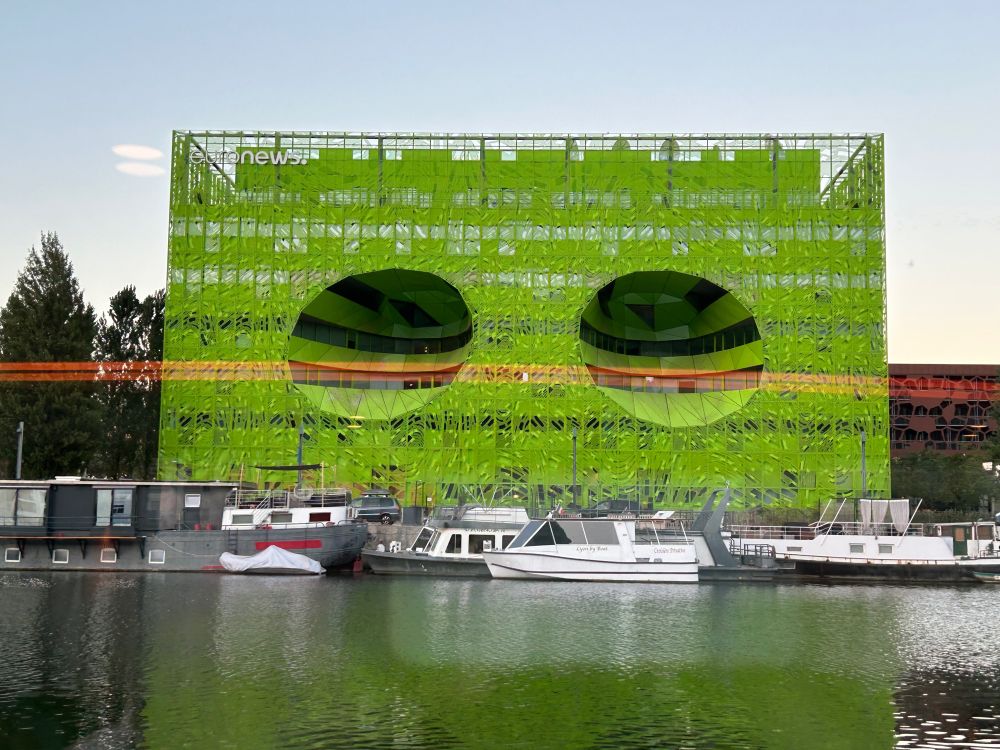 Shocking, beautiful lime green building by the river