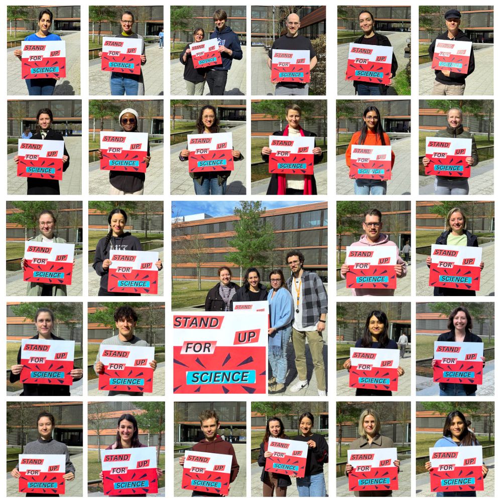 32 BMC scientists each, holding the sign "Stand up for Science"