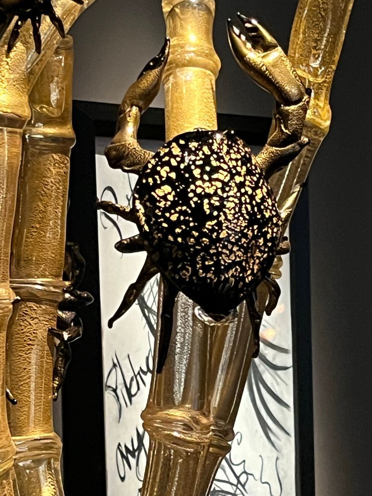 Glass crab on bamboo.